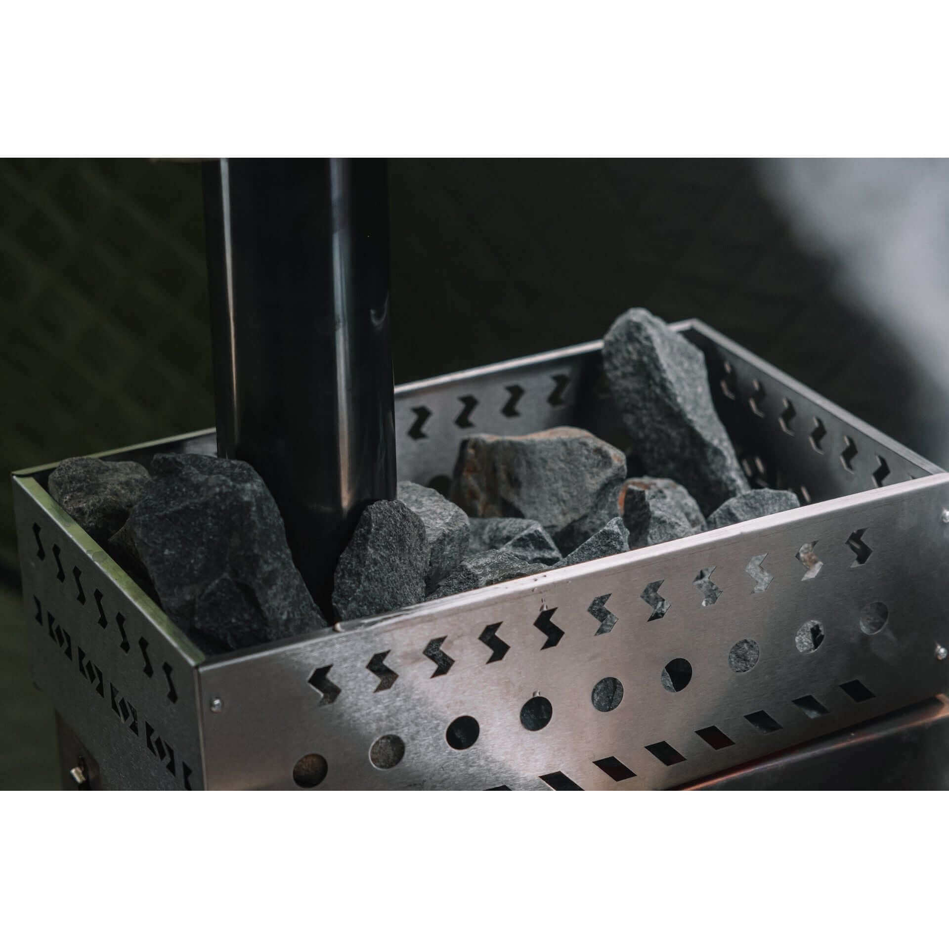 KYFE sauna stove with rock basket and steam rising