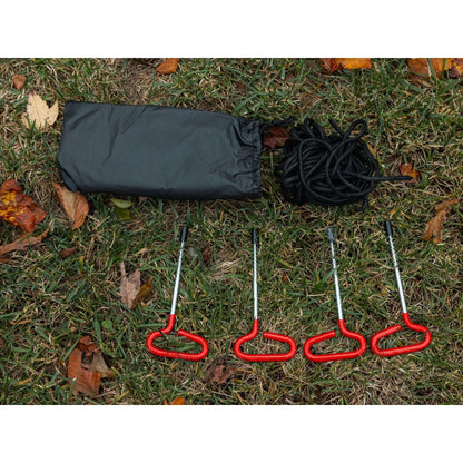KYFE portable sauna tent ground stakes, tie down ropes, and carry bag laid out on grass – outdoor sauna tent anchoring and securing accessories